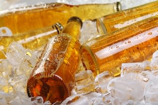 glass bottles on ice Yellow glass bottles on ice
